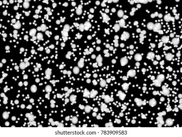 Falling snow on a black background. Vector illustration.