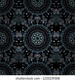 Falling snow. Seamless texture with violet, beige and blue snowflakes and dots on a black background. Starry Sky.