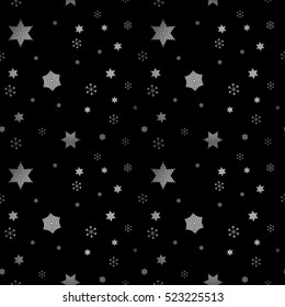 Falling snow. Seamless winter background with snowflakes. Snowfall on a black background.