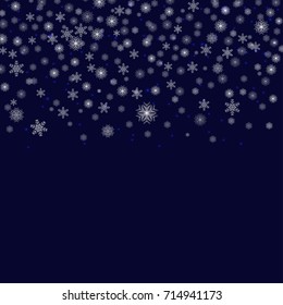 Falling snow vector pattern. Snowflakes decoration effect isolated on a blue background. Vector illustration.