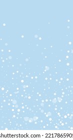 Falling snowflakes christmas background. Subtle flying snow flakes and stars on light blue winter backdrop. Beautifully falling snowflakes overlay. Vertical vector illustration.