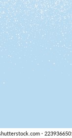 Falling snowflakes christmas background. Subtle flying snow flakes and stars on light blue winter backdrop. Beautifully falling snowflakes overlay. Vertical vector illustration.