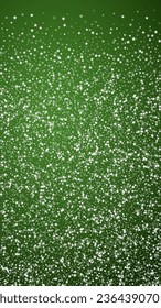 Falling snowflakes christmas background. Subtle flying snow flakes and stars on christmas green background. Beautifully falling snowflakes overlay. Vertical vector illustration.