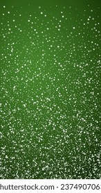 Falling snowflakes christmas background. Subtle flying snow flakes and stars on christmas green background. Beautifully falling snowflakes overlay. Vertical vector illustration.