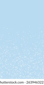 Falling snowflakes christmas background. Subtle flying snow flakes and stars on light blue winter backdrop. Beautifully falling snowflakes overlay. Vertical vector illustration.