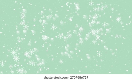 Copos de nieve que caen y partículas del brillo en un fondo verde menta suave