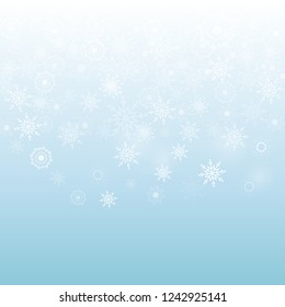 Falling snowflakes on the blue background