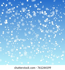 Falling snowflakes on blue background for Christmas. Vector.