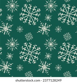 Falling snowflakes on a green background. Seamless snowflake pattern. Winter season texture design for prints. Merry Christmas. Handmade snowflakes. Repeat snowflakes. Snowflake in doodle style.