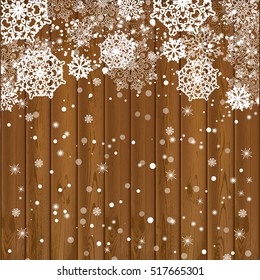 Falling snowflakes on wood texture background. Vector illustration.