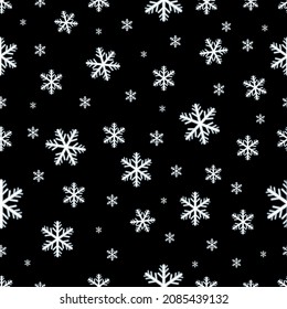 Falling snowflakes seamless pattern on black background.Repeatable pattern.
