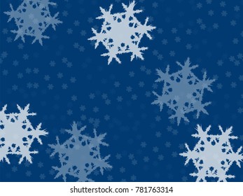 falling snowflakes, small and large on a blue background