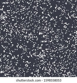 Falling white snowflakes over the dark gray background. Winter design. Vector repeated seamless pattern