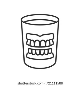 False Teeth In A Glass Of Water