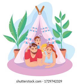 FAMILY WITH 2 CHILDREN PLAYS IN INDIANS IN A TENT