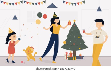 Family celebrate in the living room at home on holiday,mother holding gift box and balloon,Father carrying a drink to the camera.having tree christmas and gift box decorated, A cat playing with girl. 