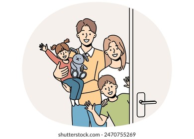 Family with children stands near door, inviting guests to banquet and waving hands in greeting. Young family with kids looks at screen in friendly way, posing on threshold of new apartment.