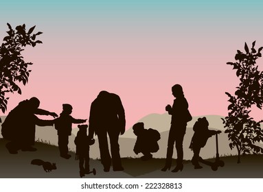 Family with children walk on a sunset.