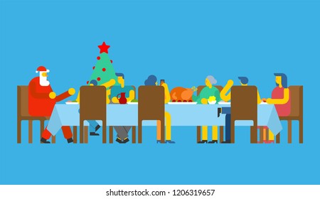 Family Christmas dinner and Santa. Big table. Red caps. holiday lunch new year. Father and mother. Grandmother and grandfather. Relatives feast
