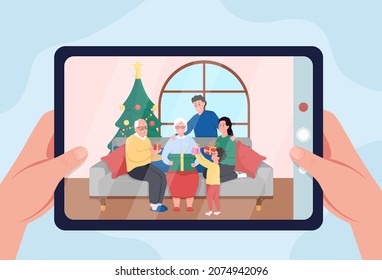 Family Christmas photo on tablet flat color vector illustration. Grandparents with children. Taking photos of happy relatives on winter holidays 2D cartoon first view hand with blue background