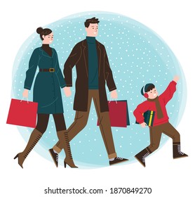 A family consist of a parent and a son doing shopping, they bring the paper bag a gift box.