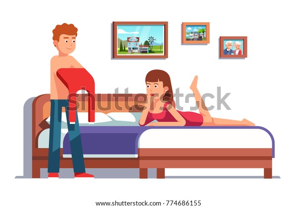 Family couple preparing to go to bed with\
each other. Woman wife inviting husband to bed to make love. Man\
undressing removing his shirt at home bedroom. Flat style vector\
isolated illustration.