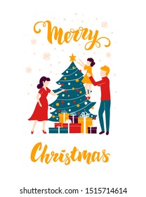 The family decorates the Christmas tree for the holiday. New Year