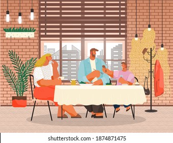 Family dining in restaurant near big window. Family members smiling mother, father and son sitting together at a table and eating dinner in modern loft style interior. Parents spend time with children