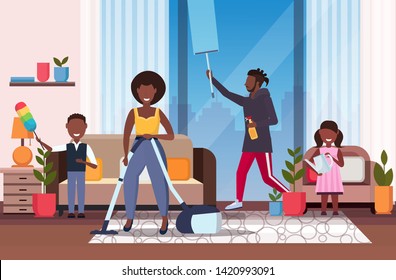 family doing housework african american father wiping window mother using vacuum cleaner children dusting and watering plants cleaning housekeeping concept living room interior full length horizontal