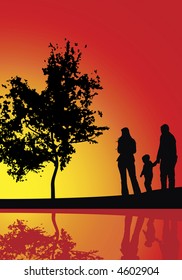family evening walking near the lake