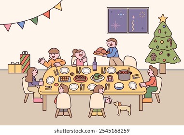 The family is gathered together for a Christmas dinner. There is a lot of food on a large table.