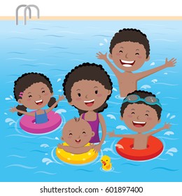 Family having fun in swimming pool