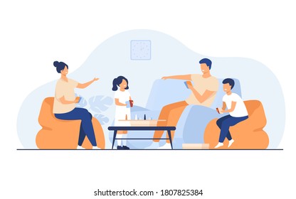 Family home activities concept. Happy boy and girl with parents playing board games with cards and dices in living room. For entertainment, togetherness, having together topics