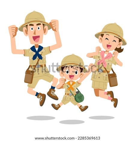 Family jumping in expedition clothes