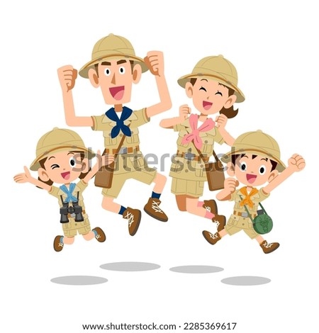 Family jumping in expedition clothes