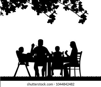 
A family lunch outdoors in the garden  one in the series of similar images silhouette