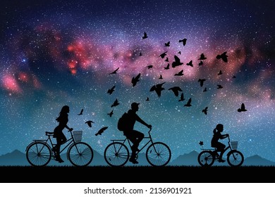 Family on bikes at blue night. Parents with children. Cyclists and dog