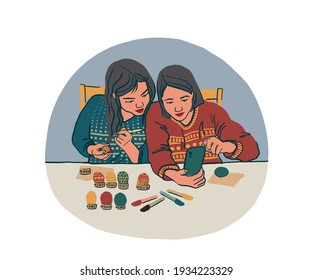Familie malt Ostereier. Zwei asiatische Mädchen zeichnen Ornamente auf Ei. Flache Frühlingsfiguren auf Cartoon-Hintergrund.Vektorgrafik. Gut geeignet für Webbanner, Karten, Poster, Print oder Webdesign