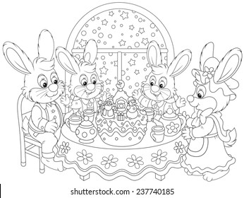 Family of rabbits at the holiday table with a Christmas cake 