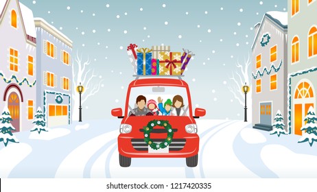 Family riding the red Car which loaded a lot of Christmas gifts in the winter town - Anonymity