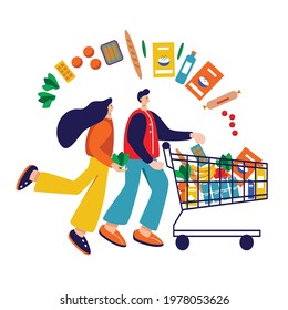 Family shopping. Man and women with shopping trolley full with groceries like milk, fruits, bread, different food and drinks.