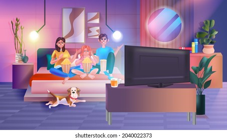 Family sitting on couch watching tv and eating popcorn happy parents and daughter spending time together