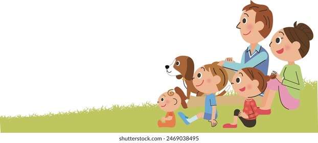 Family sitting on the grass and looking into the distance