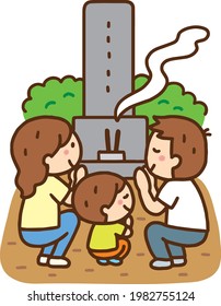 Family sitting and visiting the grave