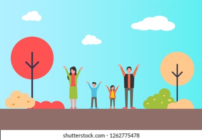 Family standing with hands up in city park. Mother, father and kids doing sport exercises outdoors. People walking on warm fall season cloth among trees