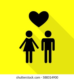 Family symbol with heart. Husband and wife are kept each other`s hands. Love. Black icon with flat style shadow path on yellow background.