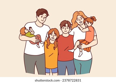 Family from teenagers and toddlers with mom and dad posing together for family portrait. Concept of guardianship of children left without parents or assistance to boys and girls from orphanages