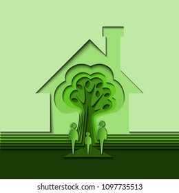 A family of three in front of the house with a tree inside.