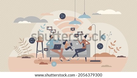 Family using internet at home while sitting on couch, tiny person concept. Spending time online together indoors. Mother, father and kid with mobile gadgets. Wireless connection and modern life tech.