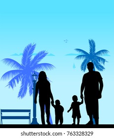 Family walking with their children on the beach